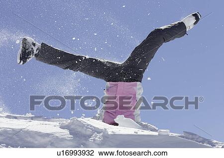 Woman in ski boots playing in snow View Large Photo Image Stock Image - Woman in ski boots playing in snow. Fotosearch