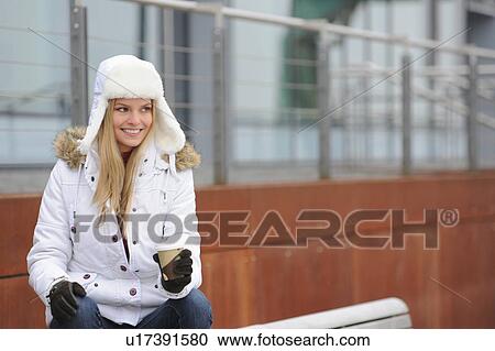 Woman in winter clothes drinking coffee View Large Photo Image Stock Image - Woman in winter clothes drinking coffee. Fotosearch