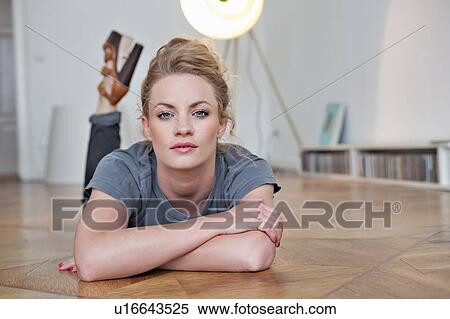 Woman laying on floor View Large Photo Image Stock Photography - Woman laying on floor. Fotosearch