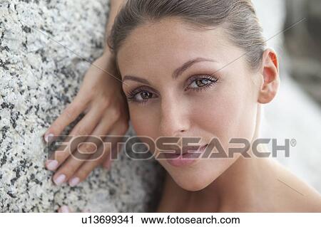 Woman laying on stone View Large Photo Image Stock Image - Woman laying on stone. Fotosearch