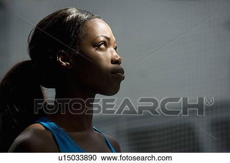 Woman looking up into light View Large Photo Image Stock Image - Woman looking up into light. Fotosearch