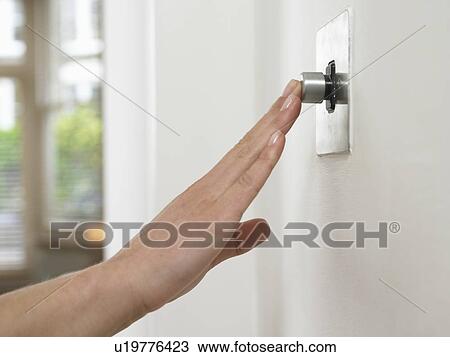 Woman pressing button on wall View Large Photo Image Stock Image - Woman pressing button on wall. Fotosearch