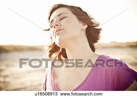 Woman relaxing outdoors View Large Photo Image Stock Image - Woman relaxing outdoors. Fotosearch