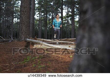 Stock Photo - Woman running in forest. Fotosearch
