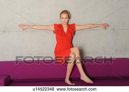 Woman sitting on purple bench View Large Photo Image Stock Photo - Woman sitting on purple bench. Fotosearch