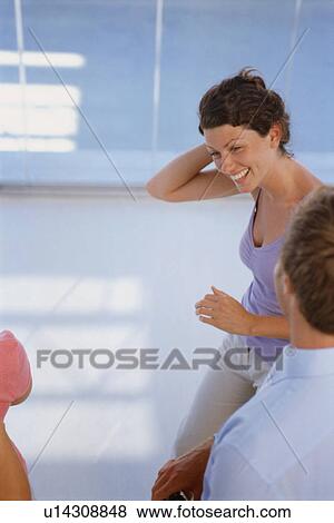 Woman smiling at friends View Large Photo Image Stock Photo - Woman smiling at friends. Fotosearch