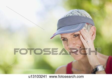 Woman smiling outdoors View Large Photo Image Stock Image - Woman smiling outdoors. Fotosearch