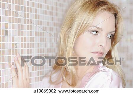 Woman standing in tiled bathroom View Large Photo Image Stock Image - Woman standing in tiled bathroom. Fotosearch