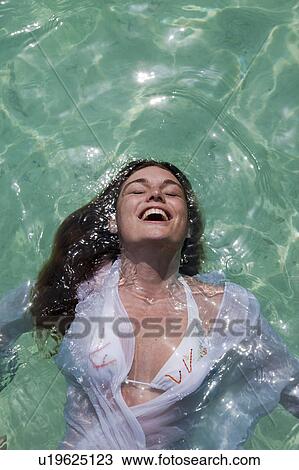 Woman swimming in tropical sea View Large Photo Image Stock Image - Woman swimming in tropical sea. Fotosearch