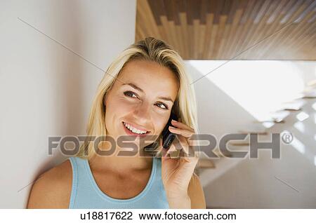 Woman talking on cell phone View Large Photo Image Stock Image - Woman talking on cell phone. Fotosearch