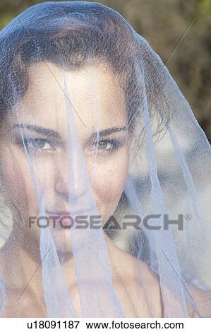Stock Photo - Woman under veil on beach. Fotosearch