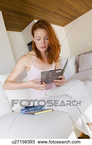 Woman unwrapping compact disc View Large Photo Image Stock Image - Woman unwrapping compact disc. Fotosearch