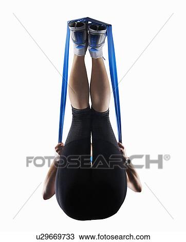 Woman using resistance band View Large Photo Image Stock Image - Woman using resistance band. Fotosearch