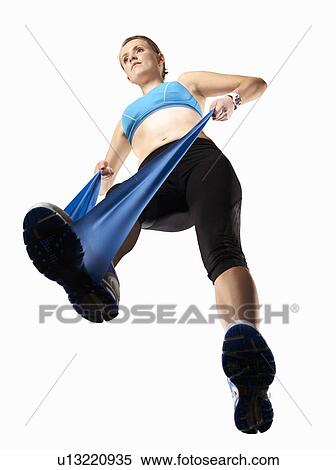 Woman using resistance band View Large Photo Image Stock Photography - Woman using resistance band. Fotosearch