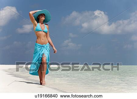 Woman walking on tropical beach View Large Photo Image Stock Image - Woman walking on tropical beach. Fotosearch