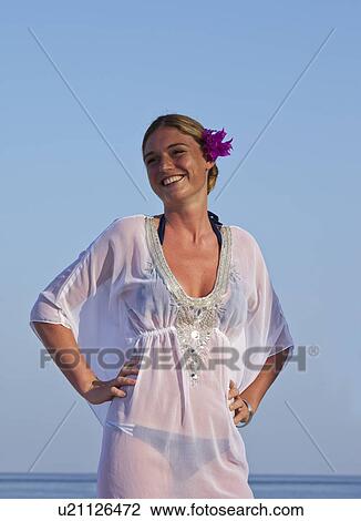 Woman wearing cover up on beach View Large Photo Image Stock Image - Woman wearing cover up on beach. Fotosearch