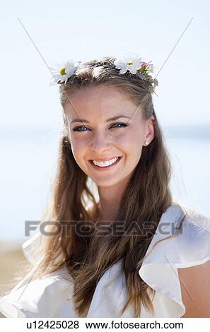 Stock Photo - Woman wearing daisy crown. Fotosearch