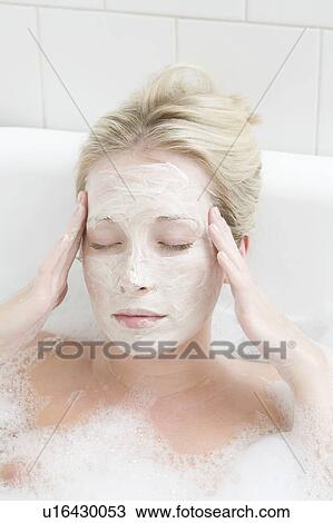 Woman wearing mask in bubble bath View Large Photo Image Stock Image - Woman wearing mask in bubble bath. Fotosearch
