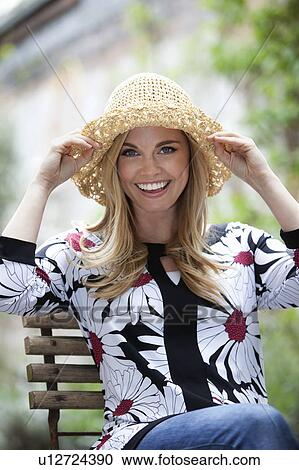 Woman wearing sunhat outdoors View Large Photo Image Stock Image - Woman wearing sunhat outdoors. Fotosearch