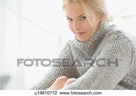 Woman wearing thick sweater View Large Photo Image Stock Image - Woman wearing thick sweater. Fotosearch