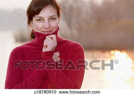 Woman wearing turtleneck sweater View Large Photo Image Stock Image - Woman wearing turtleneck sweater. Fotosearch