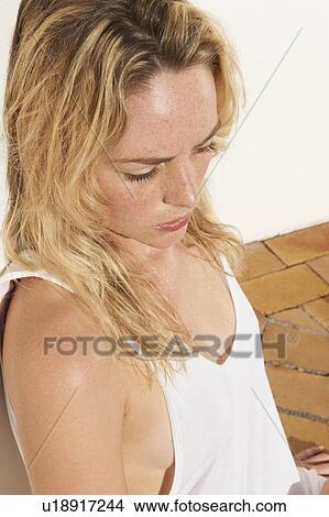 Picture - Woman wearing white tank top. Fotosearch