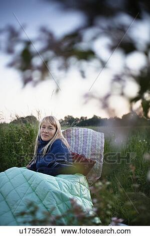 Woman wrapped in blankets outdoors View Large Photo Image Stock Image - Woman wrapped in blankets outdoors. Fotosearch