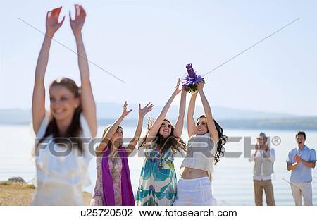 Women catching bride’s bouquet View Large Photo Image Stock Image - Women catching bride’s bouquet. Fotosearch