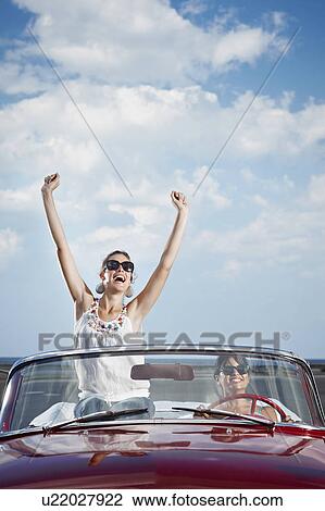 Women driving vintage convertible View Large Photo Image Stock Image - Women driving vintage convertible. Fotosearch