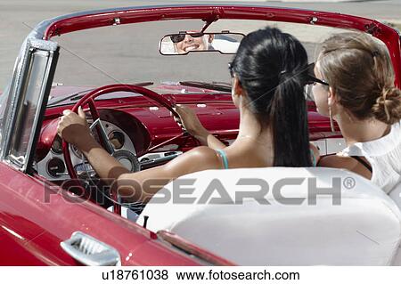 Women driving vintage convertible View Large Photo Image Stock Photo - Women driving vintage convertible. Fotosearch