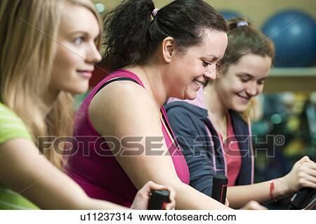 Picture - Women exercising in gym. Fotosearch