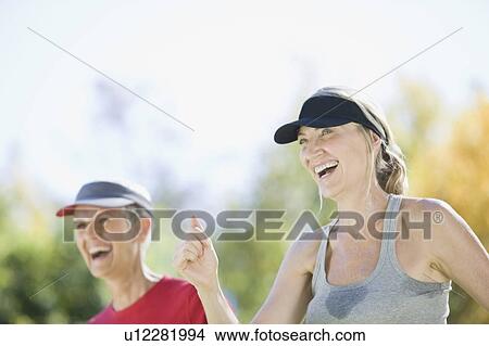 Women exercising together outdoors View Large Photo Image Picture - Women exercising together outdoors. Fotosearch
