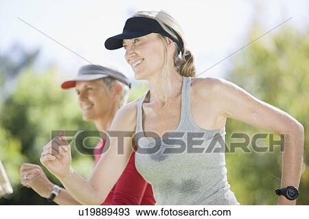Women exercising together outdoors View Large Photo Image Stock Image - Women exercising together outdoors. Fotosearch