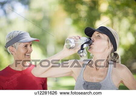 Women exercising together outdoors View Large Photo Image Stock Photograph - Women exercising together outdoors. Fotosearch