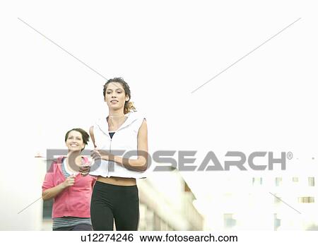 Women jogging together View Large Photo Image Stock Photograph - Women jogging together. Fotosearch