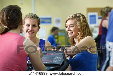 Women talking in gym View Large Photo Image Stock Photo - Women talking in gym. Fotosearch