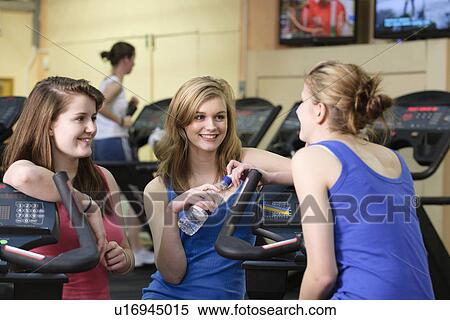Women talking in gym View Large Photo Image Stock Photography - Women talking in gym. Fotosearch