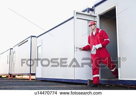 Worker exiting trailer View Large Photo Image Picture - Worker exiting trailer. Fotosearch