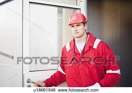 Stock Photo - Worker exiting trailer. Fotosearch