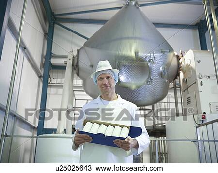 Worker holding goat’s butter in dairy View Large Photo Image Stock Image - Worker holding goat’s butter in dairy. Fotosearch