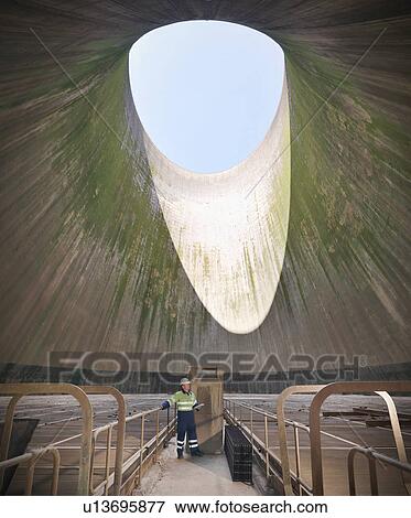 Worker in cooling tower of power station View Large Photo Image Stock Photo - Worker in cooling tower of power station. Fotosearch