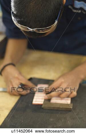 Worker measuring pieces of wood View Large Photo Image Picture - Worker measuring pieces of wood. Fotosearch