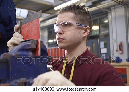 Worker measuring plastic in factory View Large Photo Image Stock Image - Worker measuring plastic in factory. Fotosearch