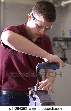 Worker using machinery in factory View Large Photo Image Stock Image - Worker using machinery in factory. Fotosearch