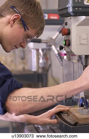 Worker using saw in factory View Large Photo Image Stock Image - Worker using saw in factory. Fotosearch