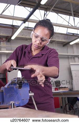 Worker using saw in factory View Large Photo Image Stock Photo - Worker using saw in factory. Fotosearch