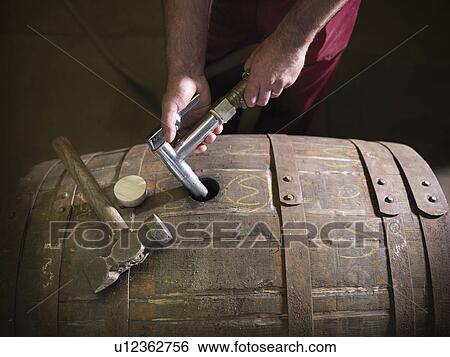 Worker with whisky barrel in distillery View Large Photo Image Stock Photograph - Worker with whisky barrel in distillery. Fotosearch