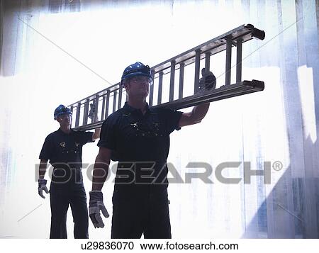Workers carrying ladder together View Large Photo Image Stock Image - Workers carrying ladder together. Fotosearch