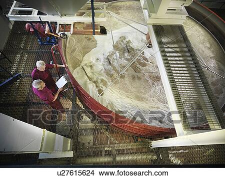 Workers checking whisky in distillery View Large Photo Image Picture - Workers checking whisky in distillery. Fotosearch