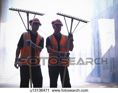 Workers holding rakes View Large Photo Image Stock Image - Workers holding rakes. Fotosearch